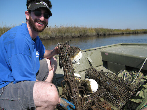 Ben Fertig collects his oyster biological indicator samples. 