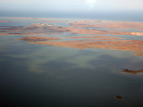 Looking west, the towns of Tylerton and beyond that is Rhodes Point on Smith Island in Chesapeake Bay.