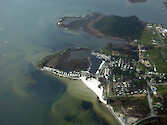 New Point Campground and RV Park. Seagrasses can be seen off the beach. 