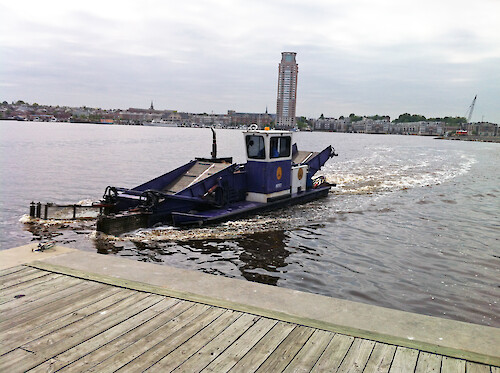 Found in Baltimore's inner harbor, this boat skims the bottom of the harbor for trash, and then compacts it.