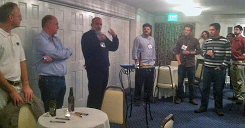 David Balcom, Tom Miller, Bill Dennison and Dave Nemazie (left to right) addressing the attendees at the UMCES party.