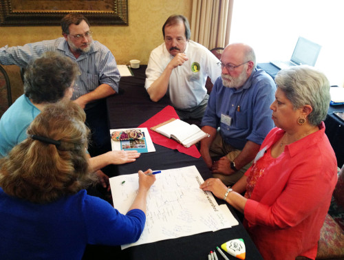 Stakeholders convene in a breakout group to discuss values, indicators, and desired condition for the Upper Missouri River at a workshop in Rapid City, South Dakota. 