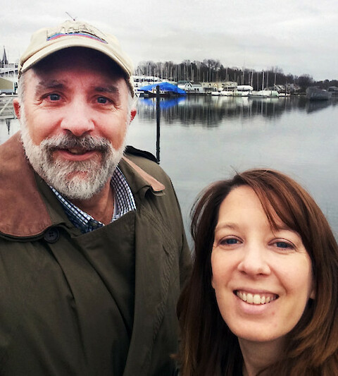 Bill Dennison and Caroline Donovan in front of Mamaroneck Harbor.