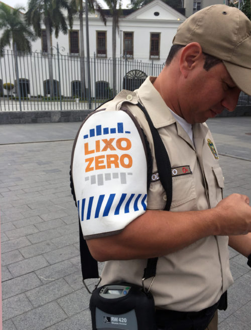 A trash police officer. His sleeve says “Zero Trash”.