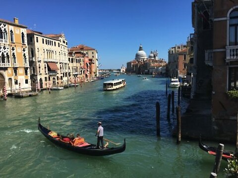 Looking over the Grand Canal from the Accademia Bridge. The Grand Canal is the main thoroughfare of Venice, linking many of the waterways throughout the city. Photo: Brianne Walsh.