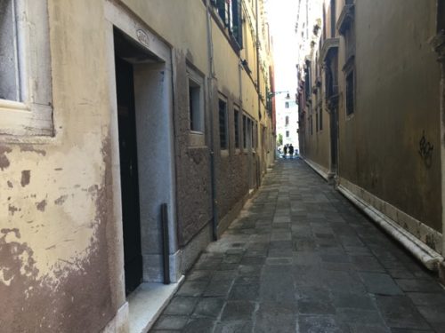 The fixture to hold a metal barrier can be seen in a doorway on a street that ends at the Grand Canal. Photo: Brianne Walsh.