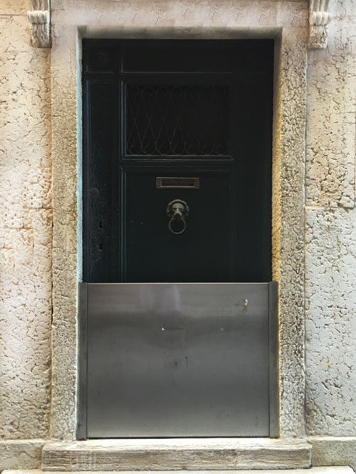 A metal barrier protects an entryway from high water. Photo: Brianne Walsh
