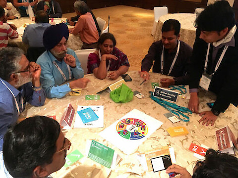 Participants playing the report card game at River Symposium 2016.
