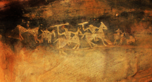 Stone age painting of men riding horses found in the Bhimbetka rock shelters in India. Photo credit: Wikimedia