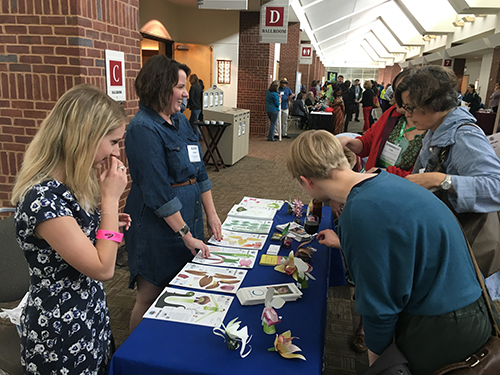Staff members of the Smithsonian Environmental Research Center Citizen Science team gave away origami orchids at their project booth during the closing reception.