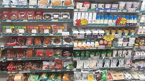 Shelves of various packaged food at a convenience store in China.