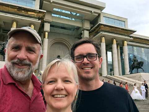 Bill Dennison, Michele Thieme and Simon Costanzo in front of the Parliament House in Ulaanbaatar, Mongolia. Photo Credit Bill Dennison