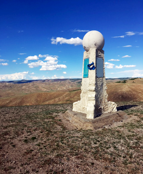 Close-up shot of the monument at the triple continental divide. Photo credit Bill Dennison
