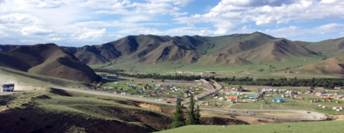 View of a tourist town beside the bank of the Tuul River. Image credit Bill Dennison
