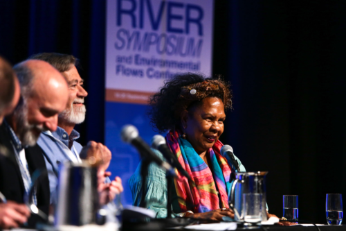 Dr. Anne Poelina speaking at the Riversymposium. Image credit International River Foundation