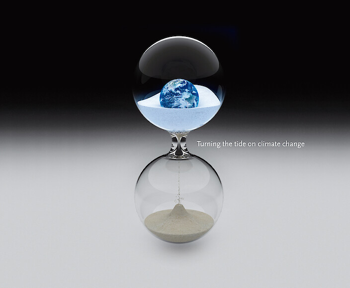An image depicting a hour glass with time running out because of climate change.