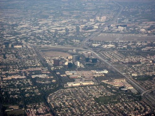 An aerial view of Irvine, California shows a fragmented landscape. (