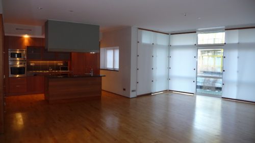 Open concept layouts are popular but require strategic planning to support the weight of the home with so few walls. (