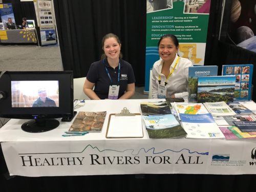 Suzi Spitzer and Vanessa Vargas-Nguyen sitting at the WWF Healthy Rivers for All booth. Photo credit: Bill Dennison.