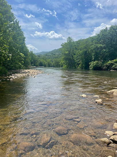 In Westernport, Maryland, lush forest surrounds the confluence of Georges Creek and the Potomac River. Bubbling and dipping around stones in its path, the water runs onward calmly.