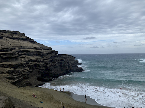Eroded Mountain over a green sand beach in Naalehu, Hawai’i. One of the most underrated places in Hawai’i that should be preserved. This was an environmental process over hundreds of years.