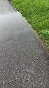 During heavy rainfall, water runs off impervious surfaces like sidewalks. Manmade or paved surfaces like roofs and roads cannot absorb water like vegetated surfaces, so rainwater flows directly into the nearest body of water, carrying sediments and other pollutants with it.